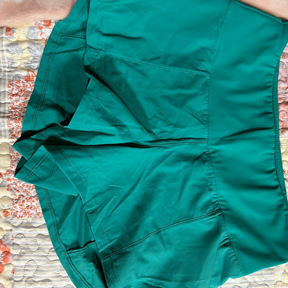 Turquoise running shorts with built in spandex shorts underneath by CVG